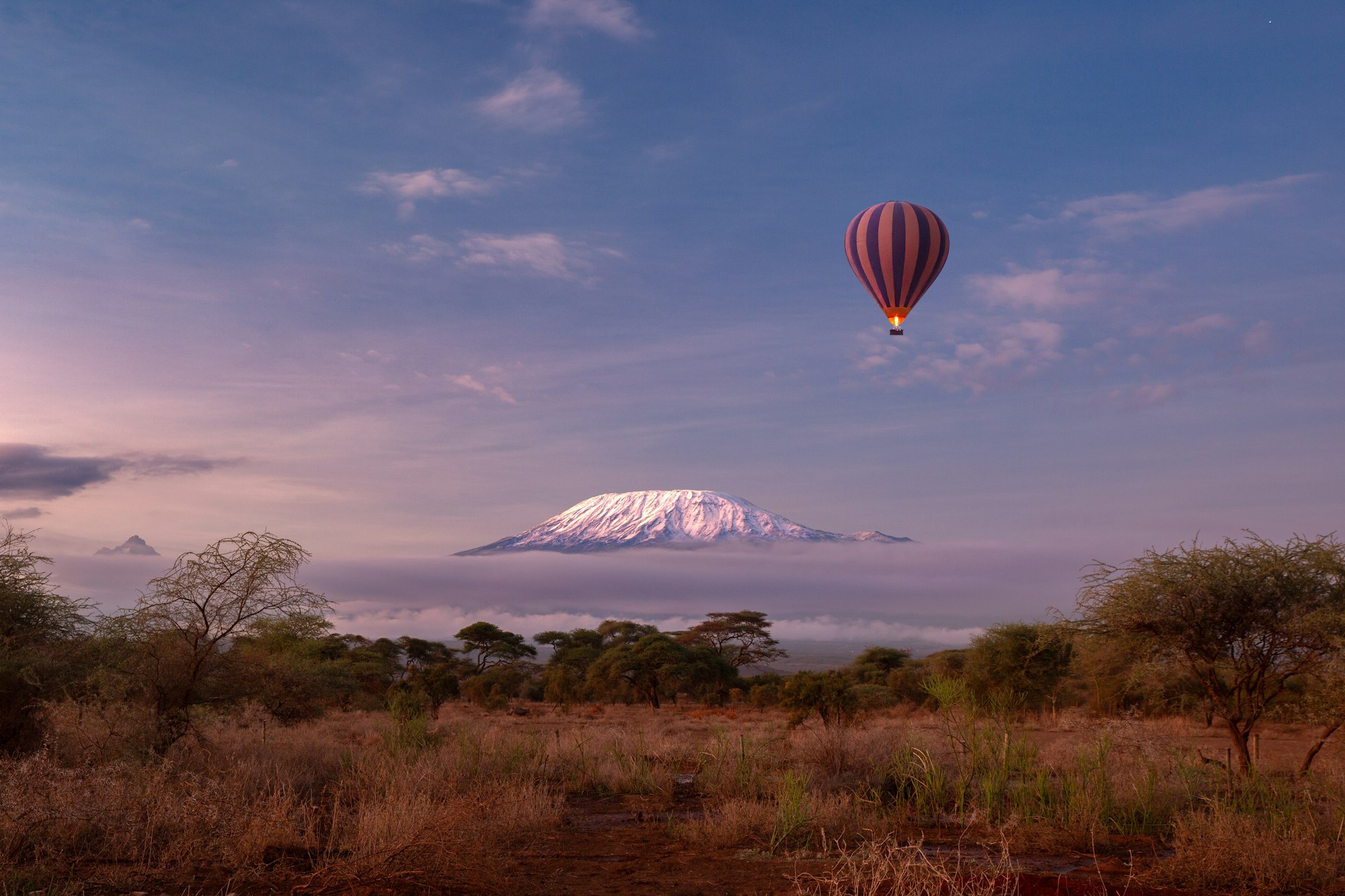 Amboseli National Park with view of the snow summit of Kilimanjaro in Kenya. Safari Hot air balloon