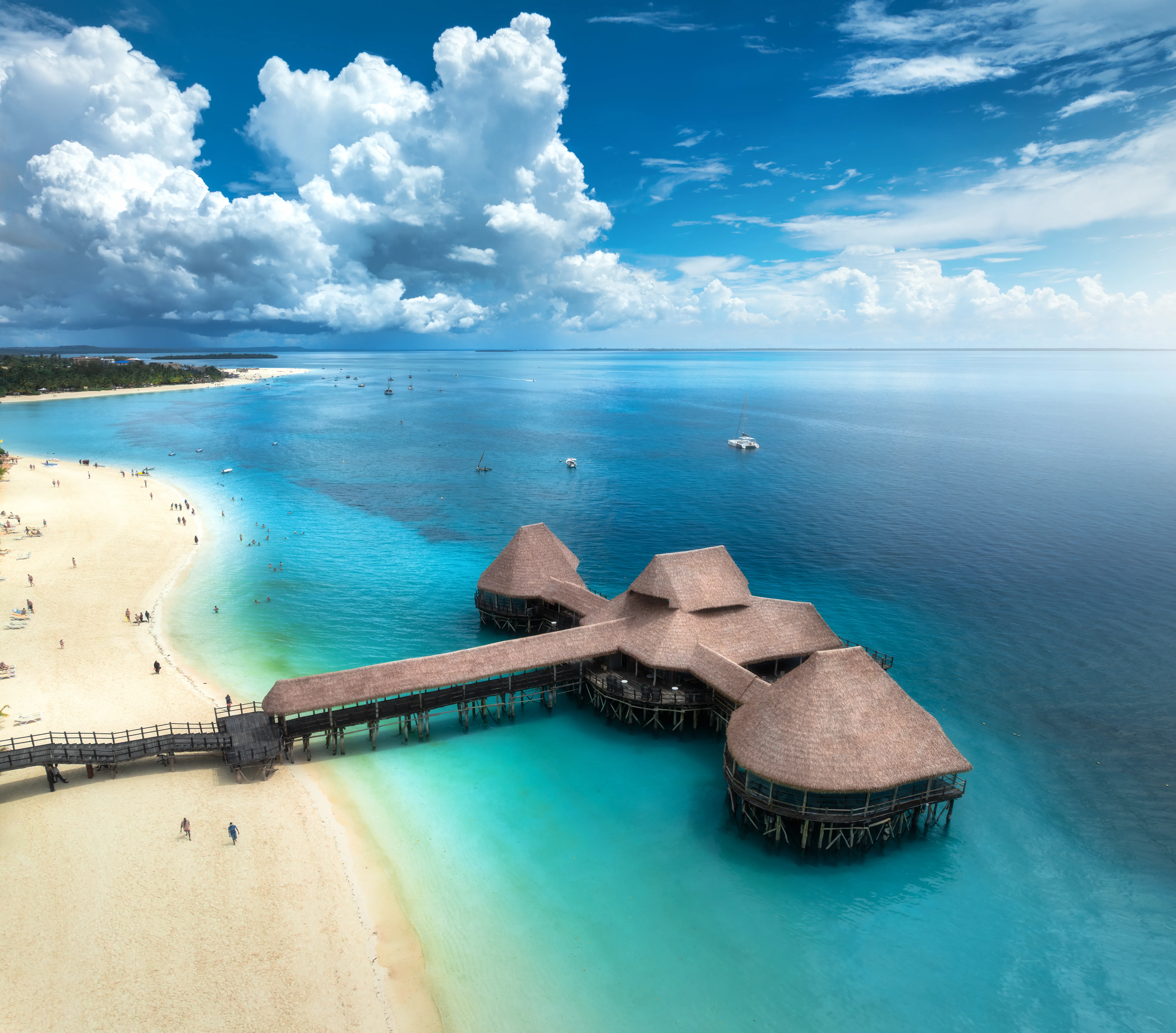 Aerial view of bungalow white sandy beach sea an
