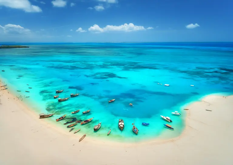 Aerial view of the fishing boats on the sandy beac