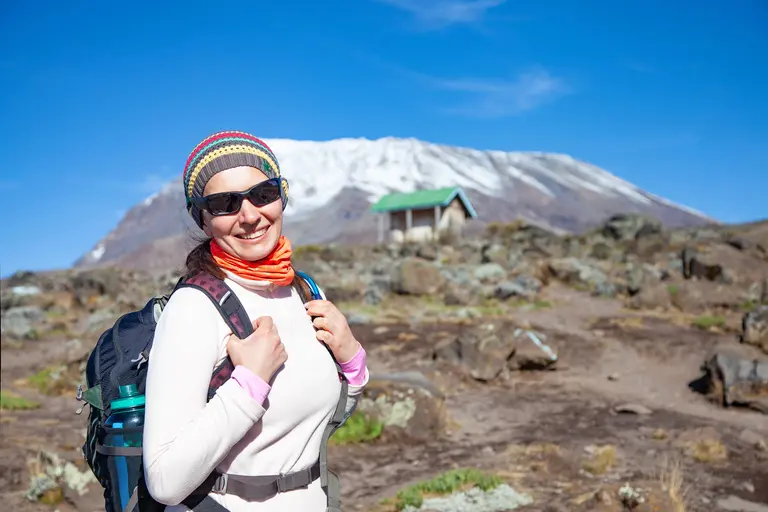 Female backpacker on the trek to kilimanjaro mount