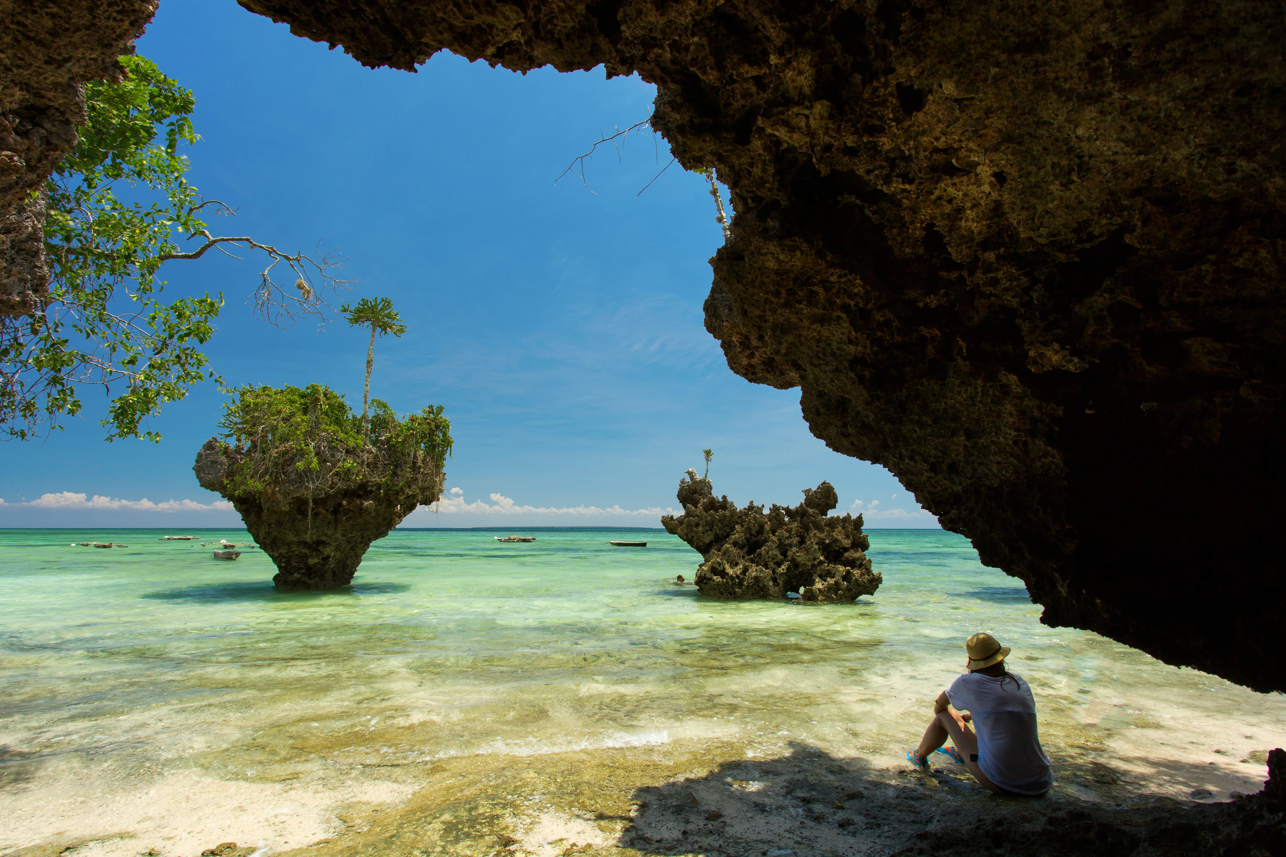 Woman resting on a wild beach in zanzibar tanzani