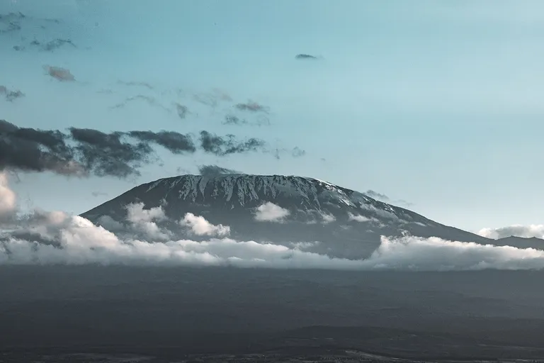 Kibo and the Kilimanjaro massif rising above the clouds
